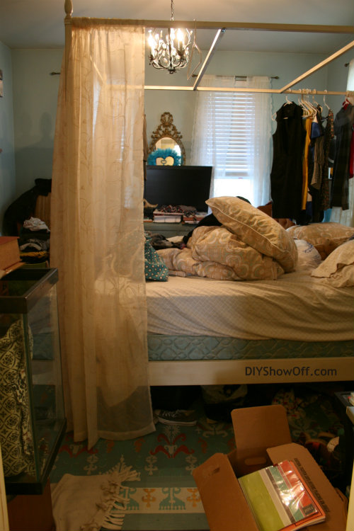 cluttered guest bedroom