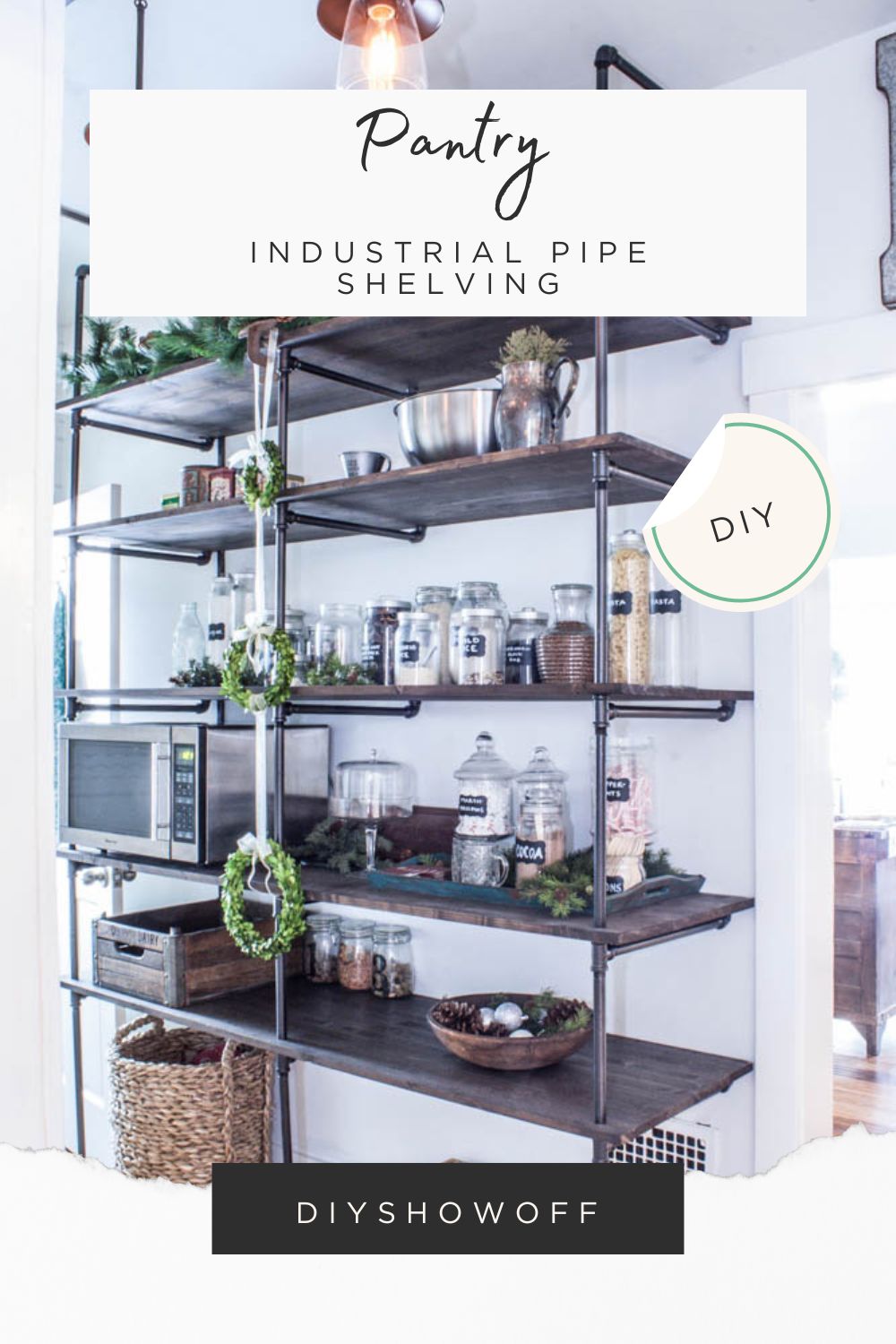 DIY industrial pipe shelving unit in pantry with wood shelves and black pipe frame for storage and decor