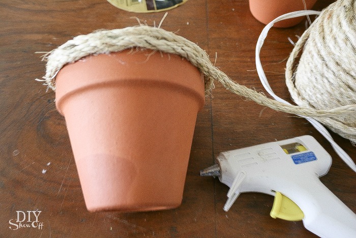 DIY sisal rope wrapped terra cotta planters tutorial at diyshowoff.com
