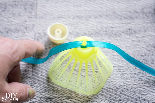 Attaching a birdie to ribbon for summer decor garland