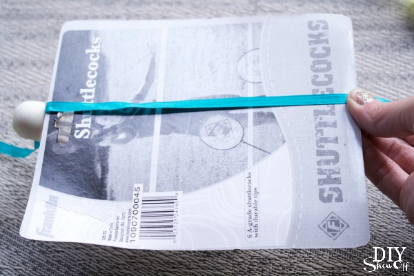 easuring and laying out ribbon with birdies for spacing