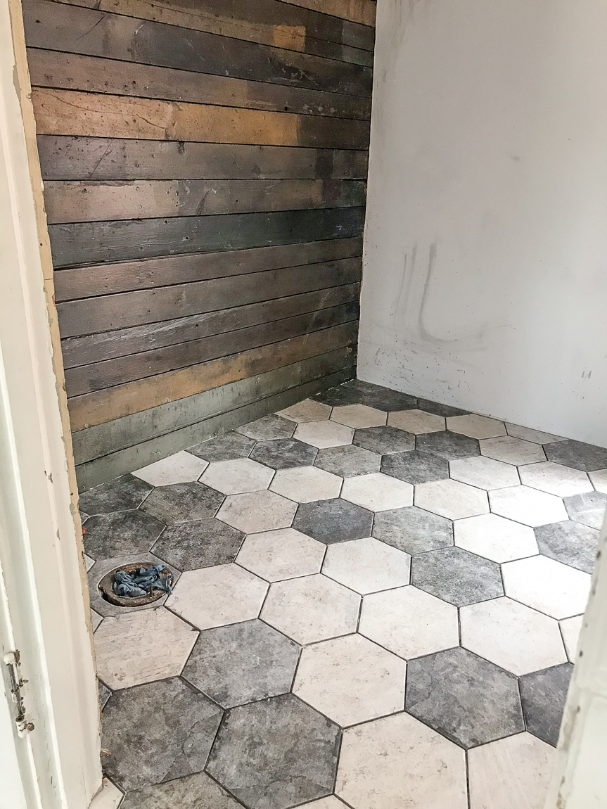 hexagon bathroom tile and wood plank wall