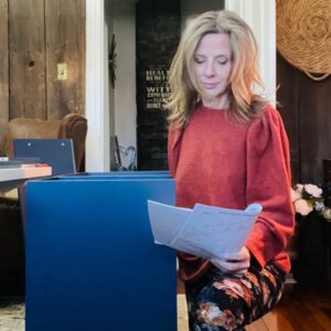 woman reading furniture assembly instructions